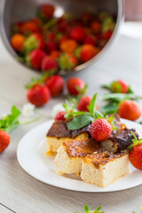 prepared cottage cheese casserole with fresh strawberries