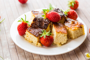 prepared cottage cheese casserole with fresh strawberries