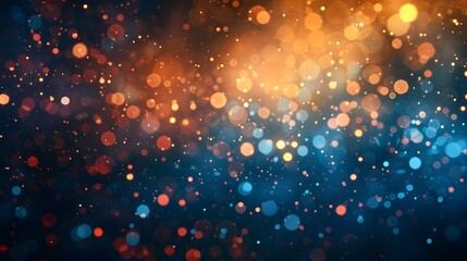 Abstract bokeh lights on a dark background, with orange and blue colors. Shiny glowing particles with a blurred defocused effect.
