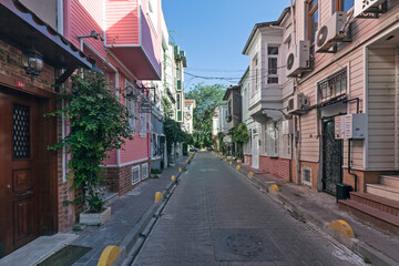 Fototapeta premium Istanbul, Turkey - July 18, 2023: Street view with colorful houses. Residential area in Istanbul, Turkey.