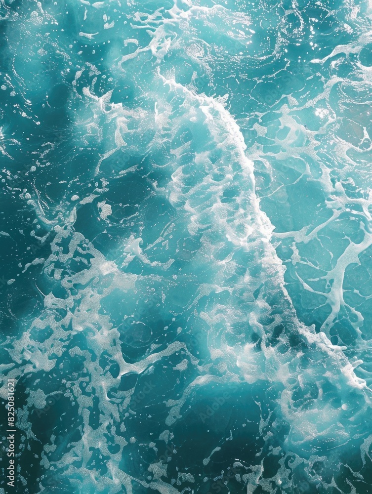 Poster the image is of a large body of water with a lot of white foam and bubbles. the water appears to be 