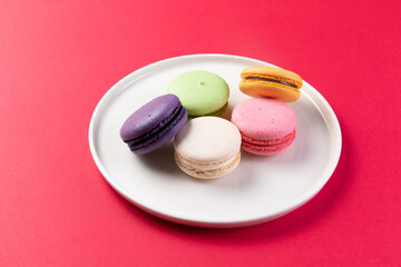 Various macarons in a plate.