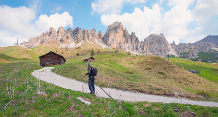 mountaineer at hiking trail Cirspitzen mountains, Grodner Joch, south tyrol