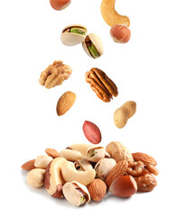 Mix of different nuts falling on white background