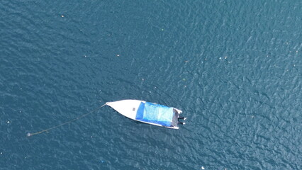 A private boat is docked at the pier