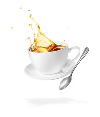Cup of coffee, saucer and spoon in air on white background