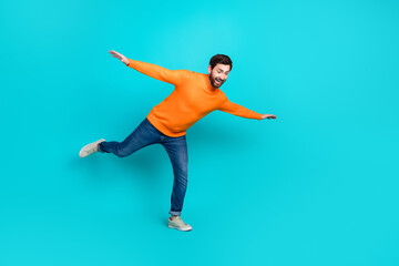 Photo of funky cheerful nice man wear trendy clothes look down empty space isolated on cyan color...