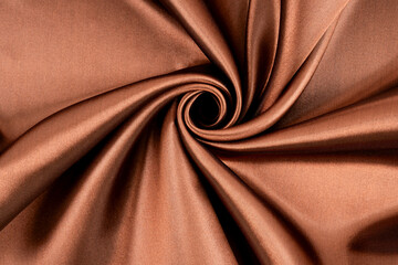 Brown background luxury cloth or wavy folds of grunge silk texture satin