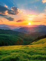 Fototapeta premium A beautiful mountain landscape with a bright orange sun in the sky. The sun is shining on the grass and trees, creating a warm and peaceful atmosphere