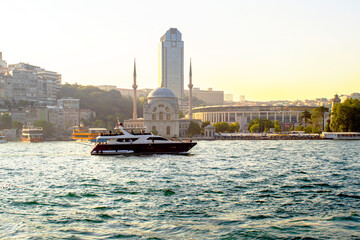 Yacht  on the bosphorus strait on the front of Dolmabahce İstanbul
