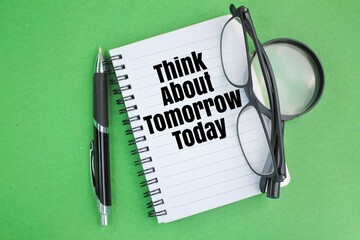 pen, glasses, magnifying glass and a book with the words Think about tomorrow today