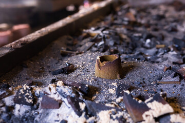 Remains of knocked out casting molds in the workshop of metallurgical plant