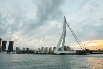Rotterdam City, Erasmus Bridge, Erasmusbrug. View across the Nieuwe Maas, New Meuse River at sunset. The Netherlands. Rotterdam Skyline