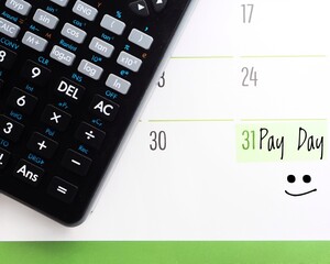 Pay Day concept: A calendar showing the number 31, with the text 'Pay Day' next to a happy face...
