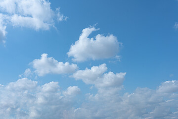 Blue Sky with Fluffy Clouds on a Sunny Day