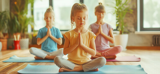 Children practicing yoga in a group session