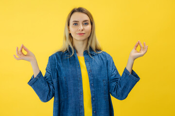 calm woman meditating, hold hands in mudra gesture, charming smile