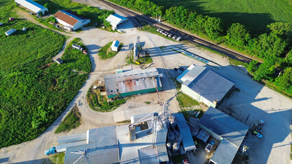 Grain silos, griding machines, warehouses, storage tanks of large feed and fertilizer mill, agro processing plant in Mountain Grove, South Central Missouri, agricultural service facility, aerial