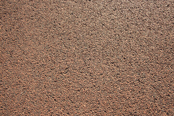 Close up of brown road surface in car park, Edinburgh, Scotland