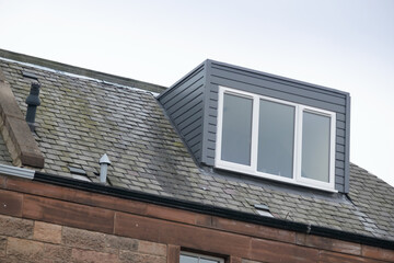 Modern box or flat dormer roof window in the Victorian suburb of Morningside, Edinburgh, Scotland, UK