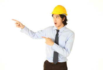 Wow, Portrait of a young engineer wear helmet pointing finger and he is surprised face with white background
