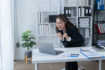 Happy businesswomen working at the office 