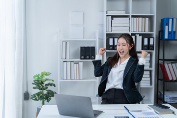 The Asian female business professional displayed a cheerful expression in her office.