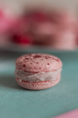 pink macarons served with cherries 