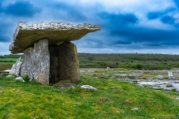 Poulnabrone dolmen in Burren geopark, Ireland, with dramatic cloud sky