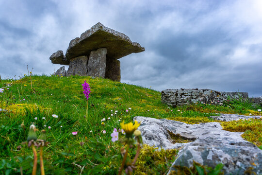 Poulnabrone dolmen in Burren geopark, Ireland, with dramatic cloud sky
