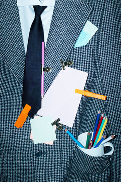 Business corporate office tweed suit with tie, pencils, post it notes 