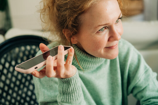 Close up of woman listening to voice message