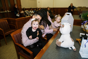 Lgbtq mothers in court with their daughters on adoption day