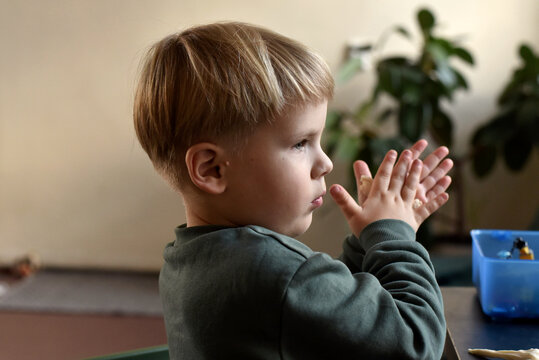 Boy playing with plasticine