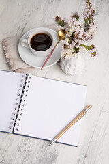 Little white Coffee cup and notepad morning planning