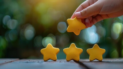 A hand is pointing at four stars on a table, The best excellent business services rating customer experience concept
