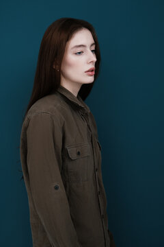 Woman in shirt on blue background