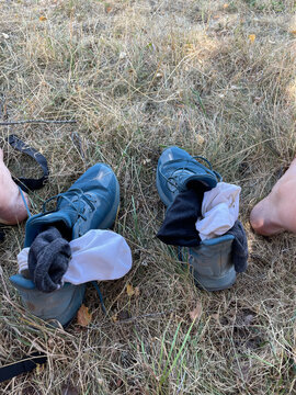 UGC of hiker who took shoes off because of blisters. 