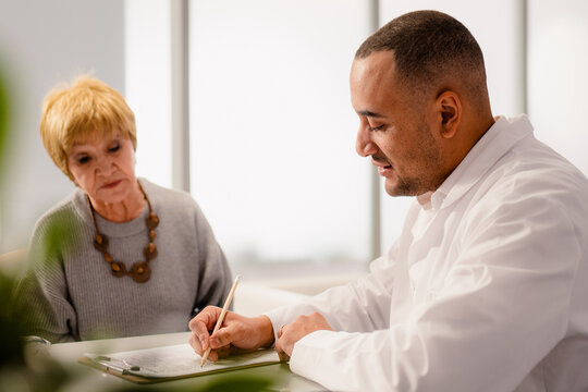 An elderly woman at a doctor's appointment