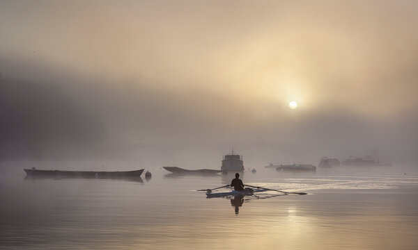 Rower at sunrise