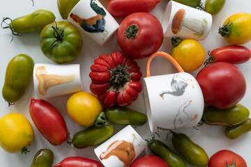 Top view of ripe seasonal vegetables and creative ceramic glasses on the table