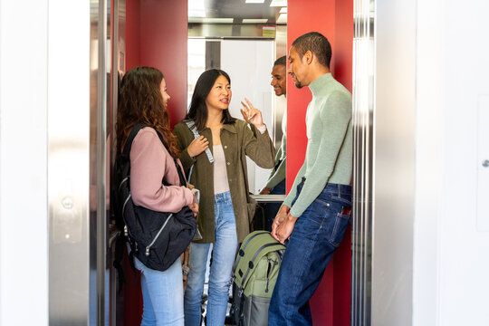 Coworker friends inside elevator