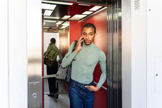 Man use phone elevator