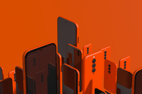 Assortment of smartphones on orange background