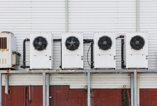 Multiple ventilation systems installed on a white wall.
