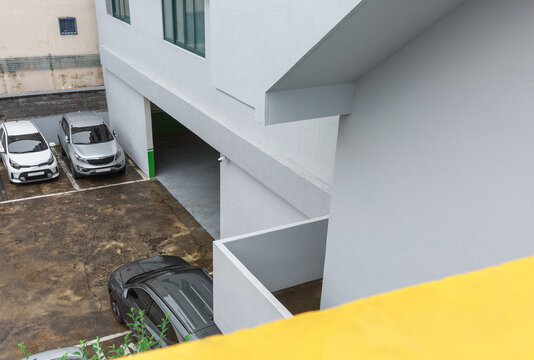 Gray office building and parking lot.