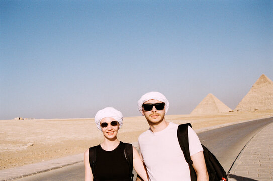 Smiling Couple Visiting the Pyramids in Egypt