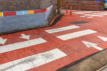 Crosswalk and arrow drawn at intersection.