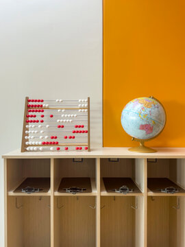 abacus and globe on shelf