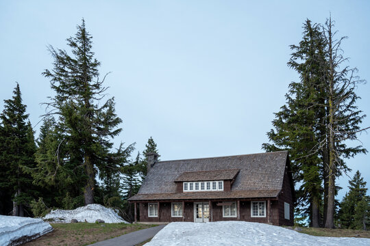 Wooden cabin surrounded with snow in Crater Lake